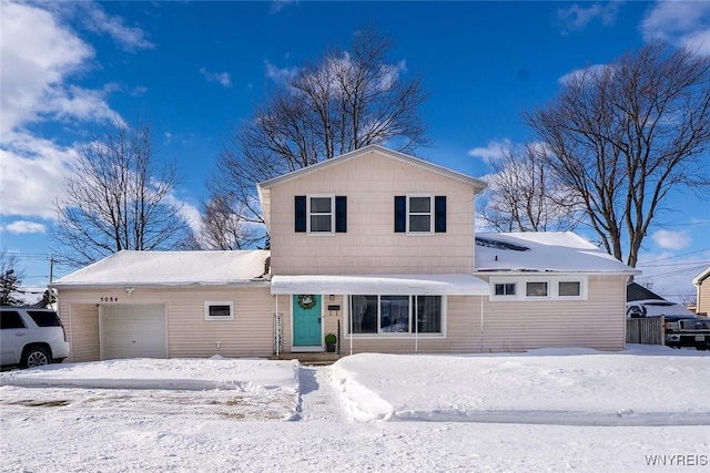 front of property with a garage