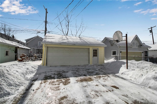 view of snow covered garage