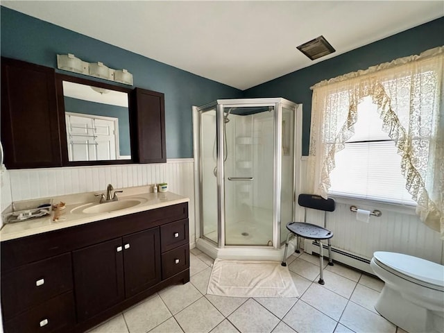 bathroom featuring an enclosed shower, tile patterned floors, toilet, a baseboard radiator, and vanity