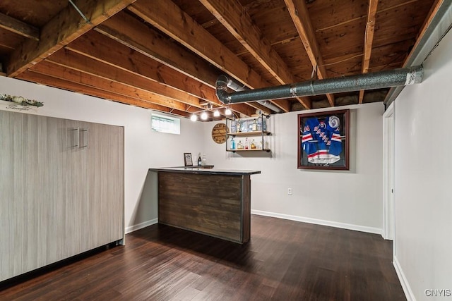 bar with dark hardwood / wood-style flooring