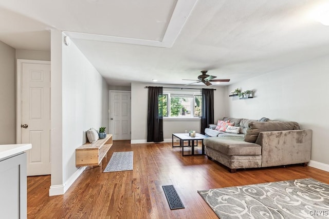 living room featuring ceiling fan and wood-type flooring