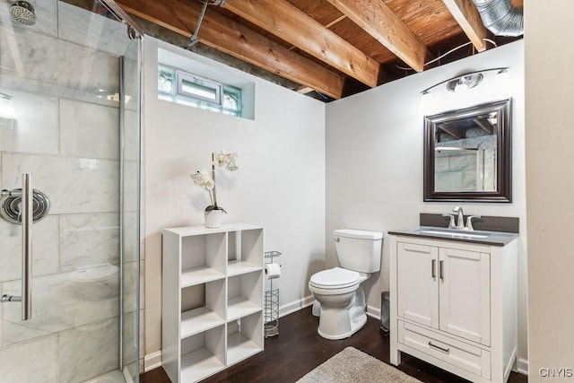 bathroom with toilet, vanity, walk in shower, and hardwood / wood-style floors