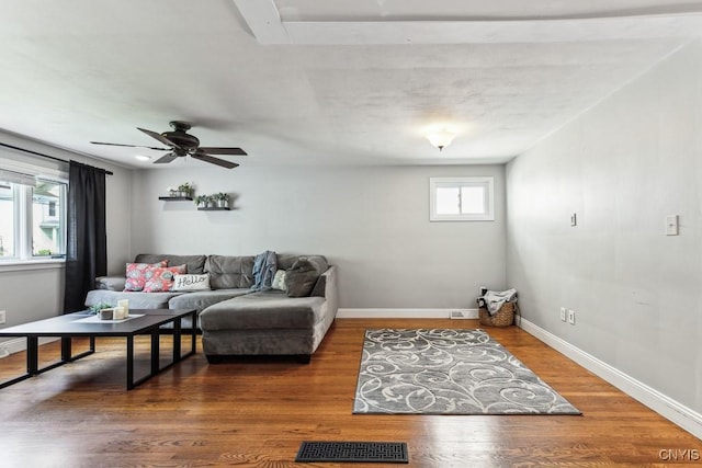 living room with ceiling fan and hardwood / wood-style floors