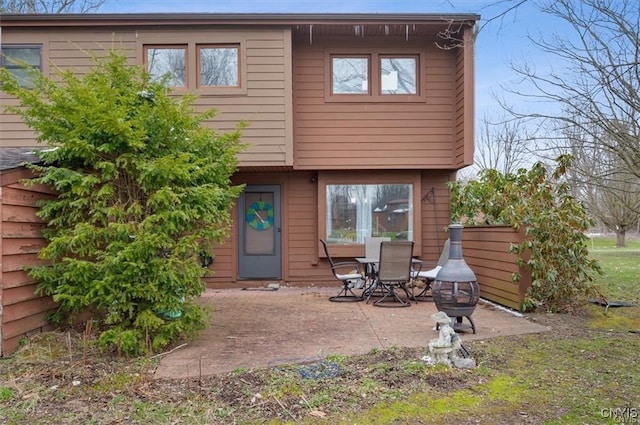 back of house with a patio area