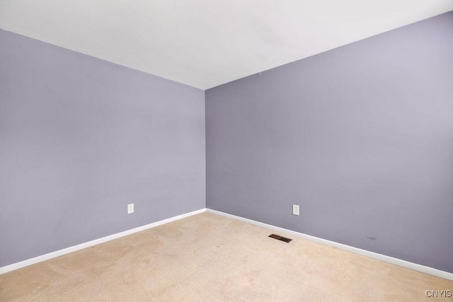 empty room featuring carpet flooring