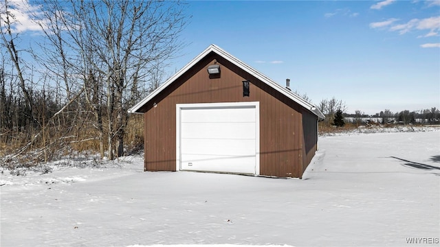 view of snow covered garage