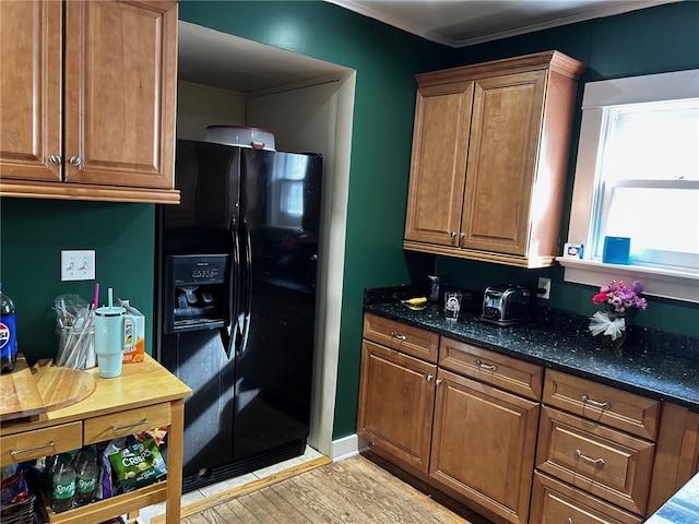 146 N Broad St, Norwich-City, NY 13815 - kitchen with dark stone countertops, light hardwood / wood-style flooring, and black fridge