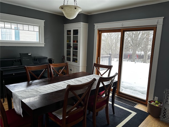 146 N Broad St, Norwich-City, NY 13815 - dining area featuring light wood-type flooring and crown molding