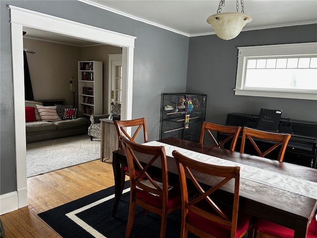 146 N Broad St, Norwich-City, NY 13815 - dining area featuring hardwood / wood-style floors and ornamental molding