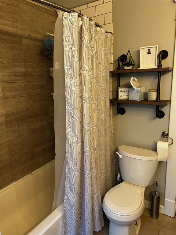 146 N Broad St, Norwich-City, NY 13815 - bathroom with tile patterned floors, toilet, and shower / tub combo