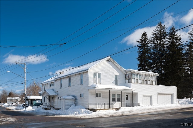 view of front of house with a garage and a porch