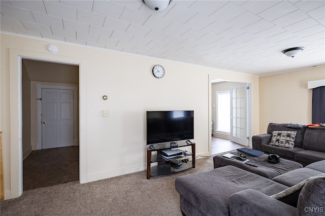 carpeted living room with crown molding