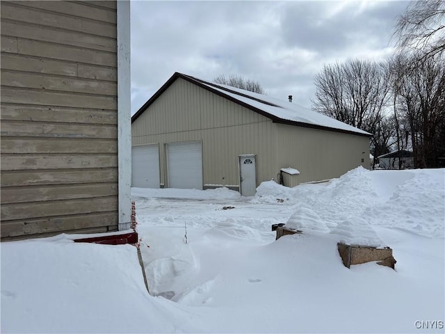 view of snow covered garage