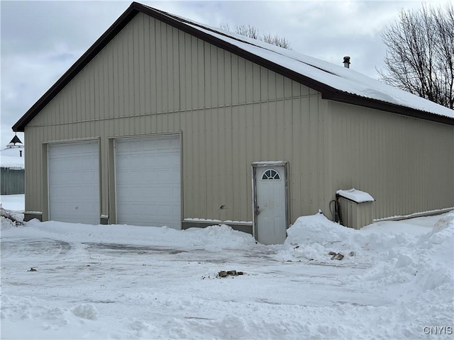 view of snow covered garage