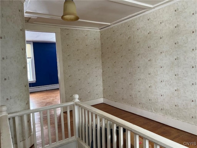 hallway with hardwood / wood-style floors and baseboard heating