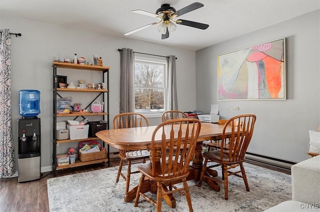 dining area with hardwood / wood-style flooring and ceiling fan