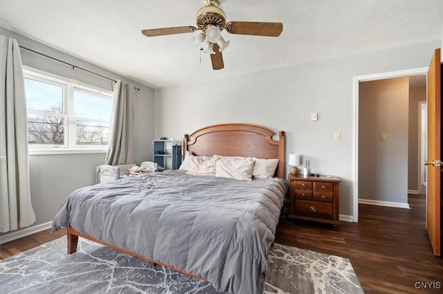 bedroom featuring ceiling fan and dark hardwood / wood-style floors