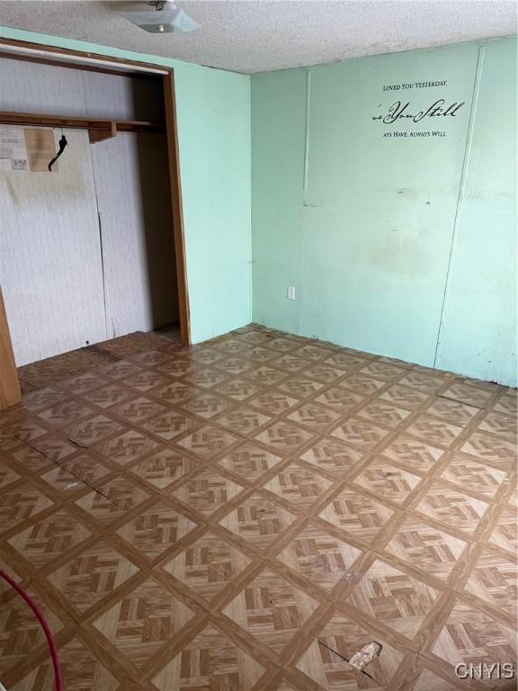 11082 State Route 26, Denmark, NY 13619 - spare room featuring a textured ceiling