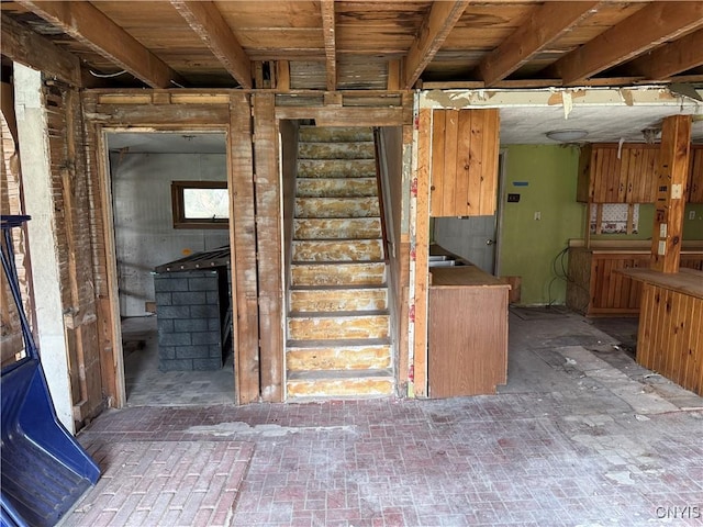 interior space featuring brick floor