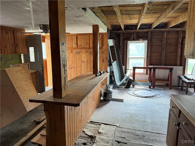 misc room with ceiling fan and a wealth of natural light
