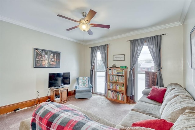 living room featuring ceiling fan, crown molding, and light carpet