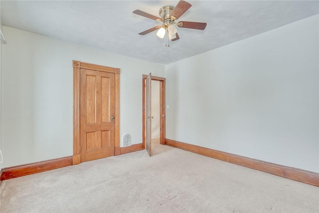 carpeted empty room with ceiling fan