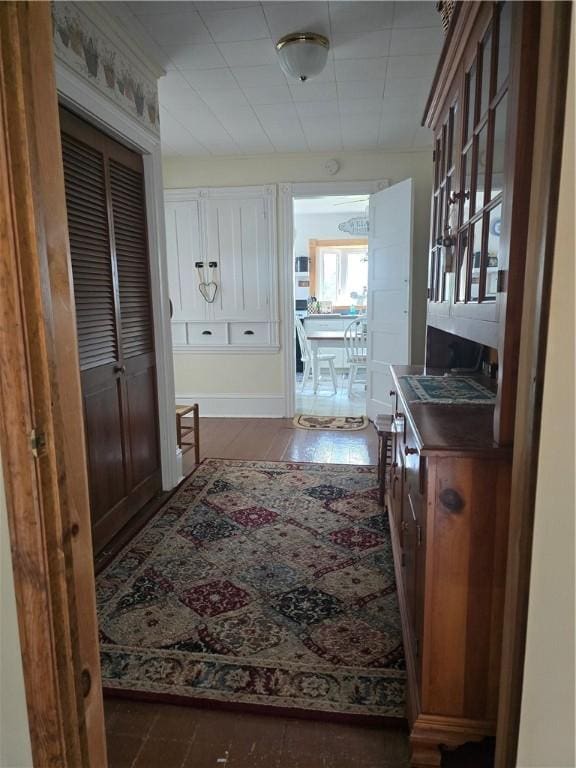 hall featuring dark wood-type flooring