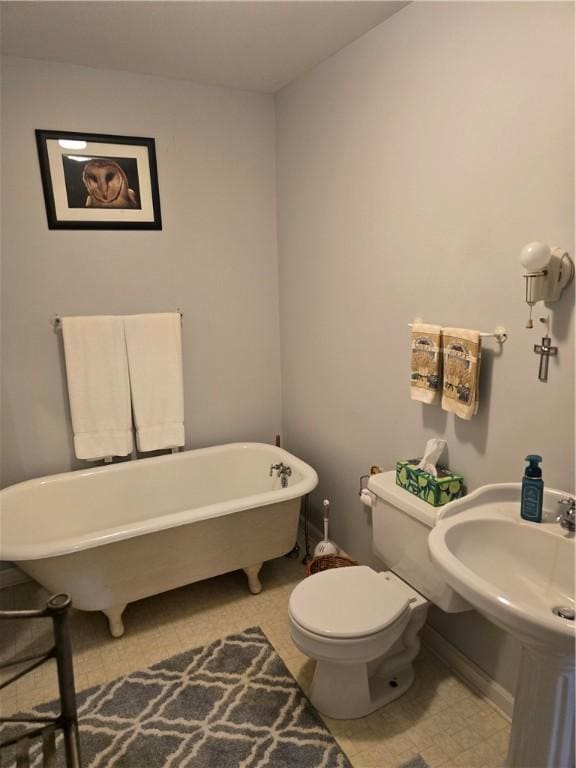 bathroom featuring a bathtub and toilet