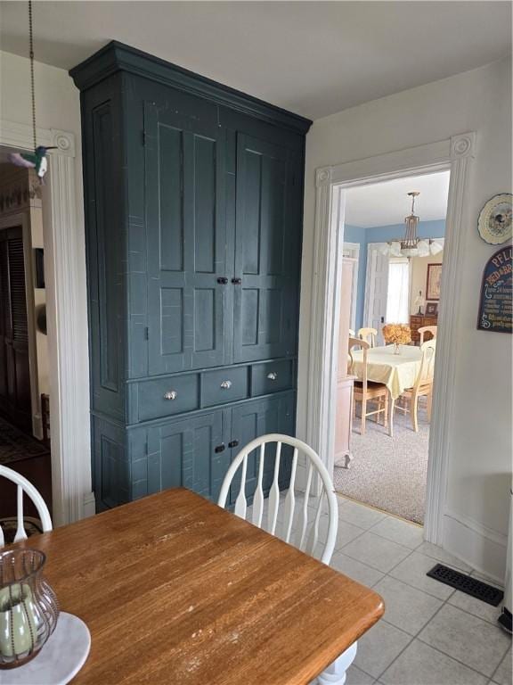 dining room featuring light tile patterned flooring