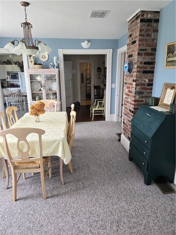 dining area featuring carpet flooring