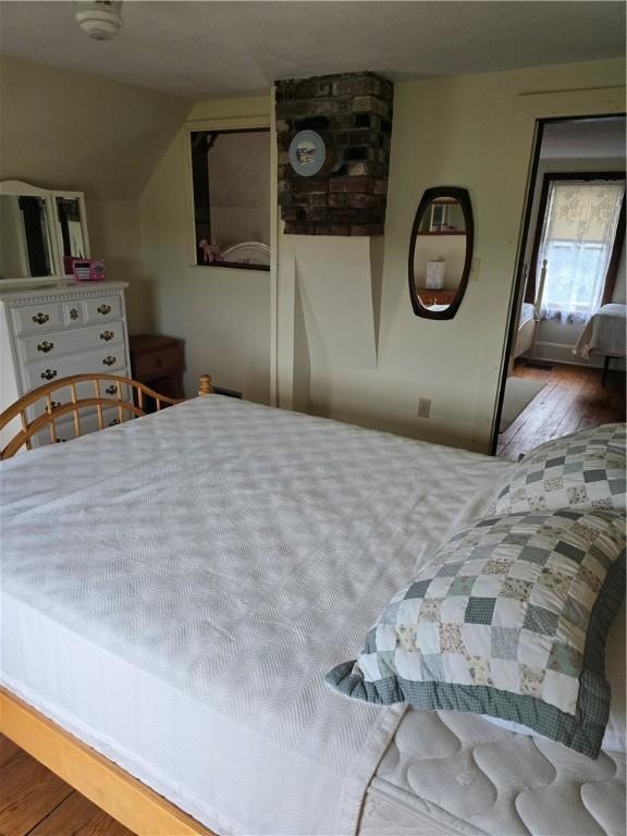 bedroom with hardwood / wood-style floors