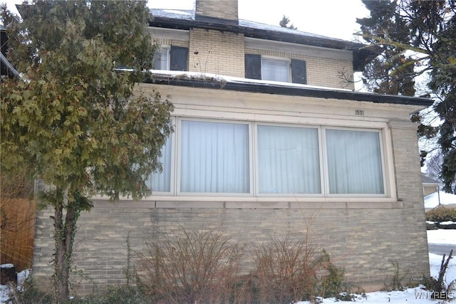 view of snow covered property