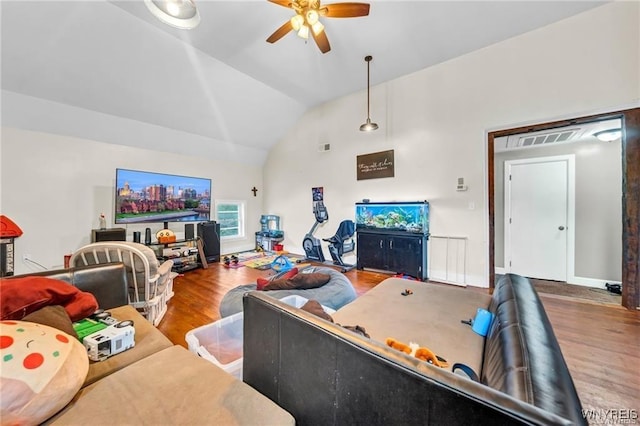 living room with hardwood / wood-style floors, lofted ceiling, and ceiling fan