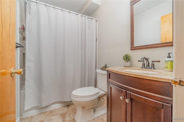 bathroom with toilet and vanity