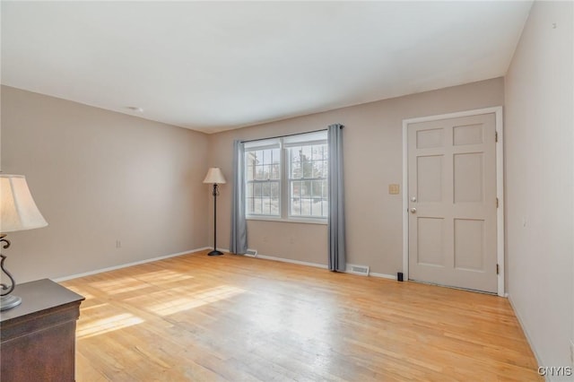 unfurnished living room with light wood-type flooring