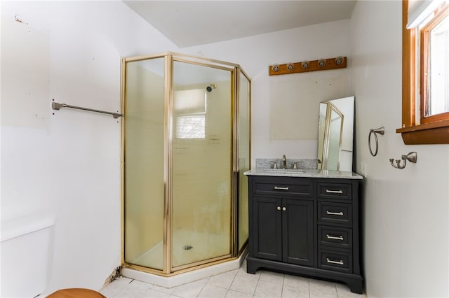 bathroom with vanity and a shower with shower door