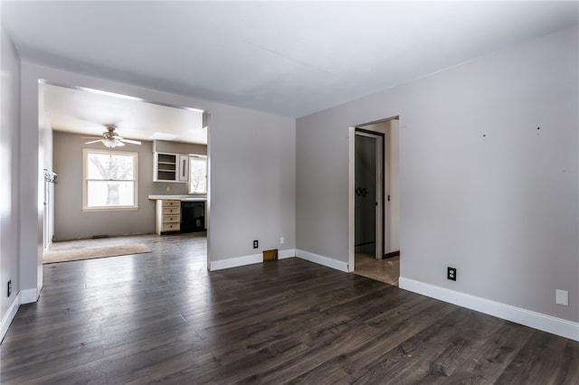 unfurnished living room with ceiling fan and dark hardwood / wood-style floors