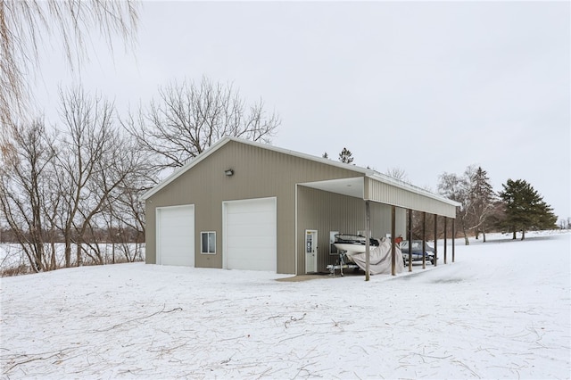 view of snow covered garage