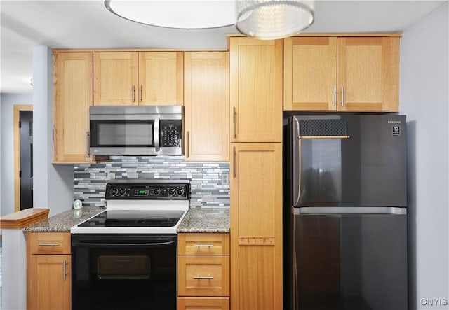 kitchen with light brown cabinets, stone counters, refrigerator, backsplash, and electric range