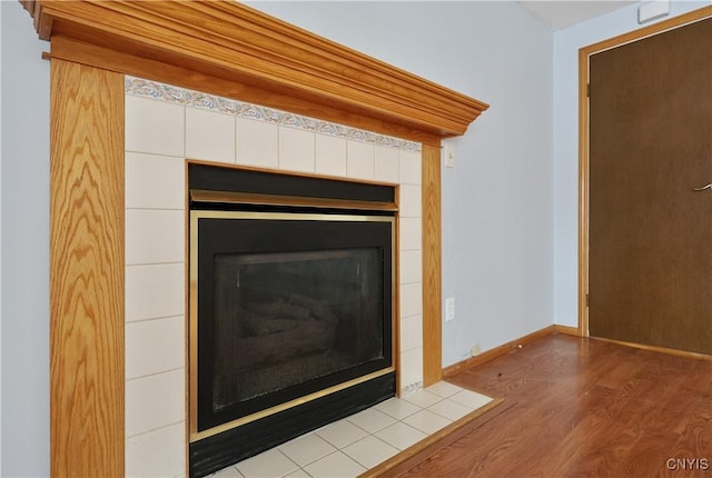 interior details with a fireplace and hardwood / wood-style flooring