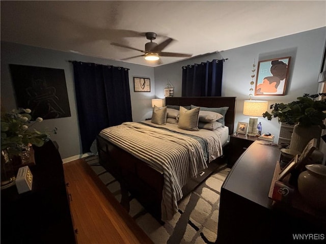 bedroom featuring hardwood / wood-style flooring and ceiling fan