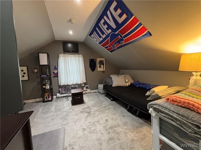 bedroom featuring carpet and lofted ceiling