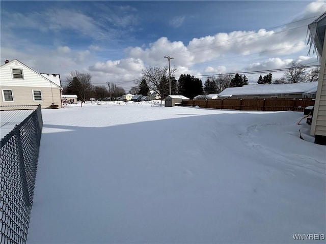 view of yard layered in snow