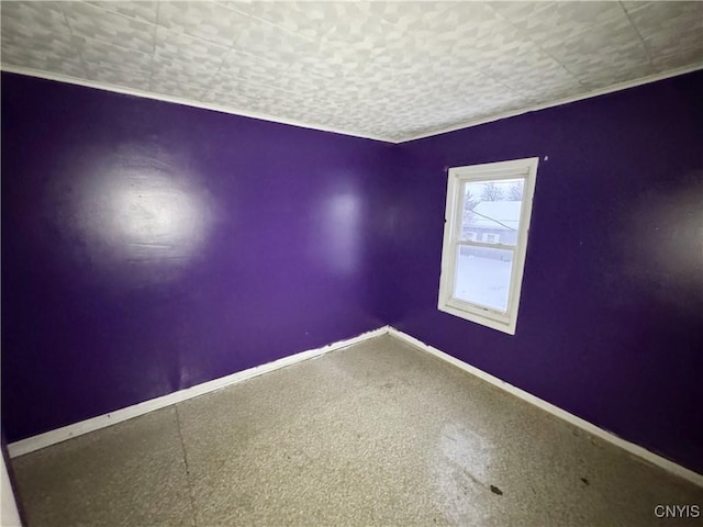 spare room with a textured ceiling