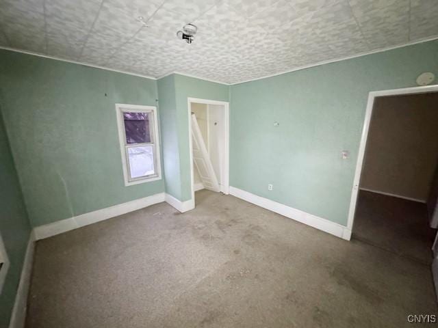 unfurnished bedroom with carpet flooring