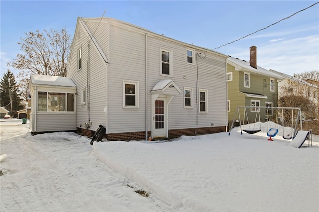 view of snow covered house