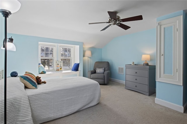 carpeted bedroom featuring lofted ceiling and ceiling fan