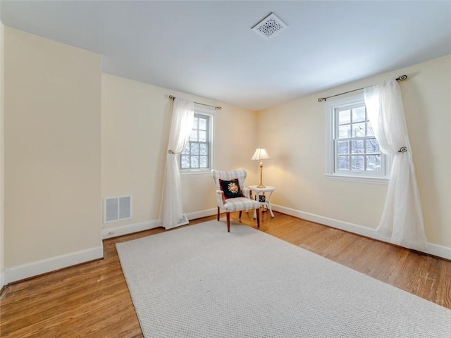 sitting room featuring light wood-type flooring