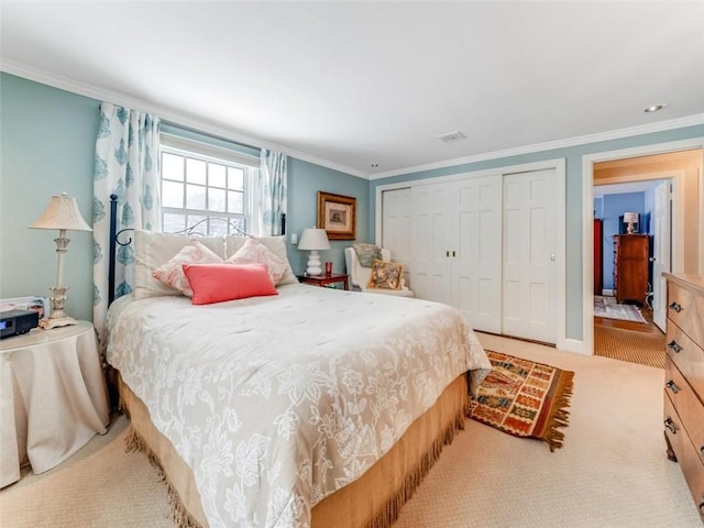 carpeted bedroom featuring a closet and ornamental molding