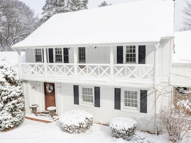 view of snowy property